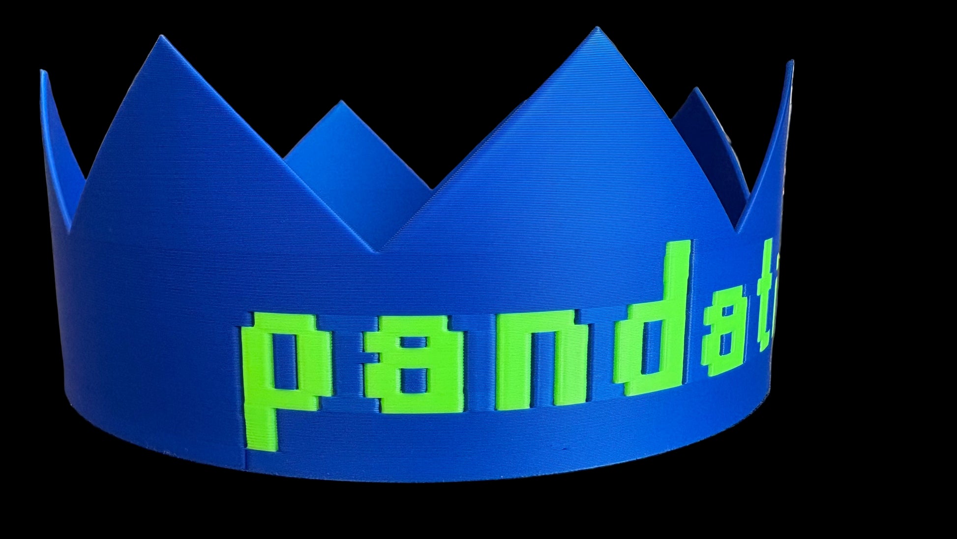 Blue crown with green 'panda' text on a metallic surface